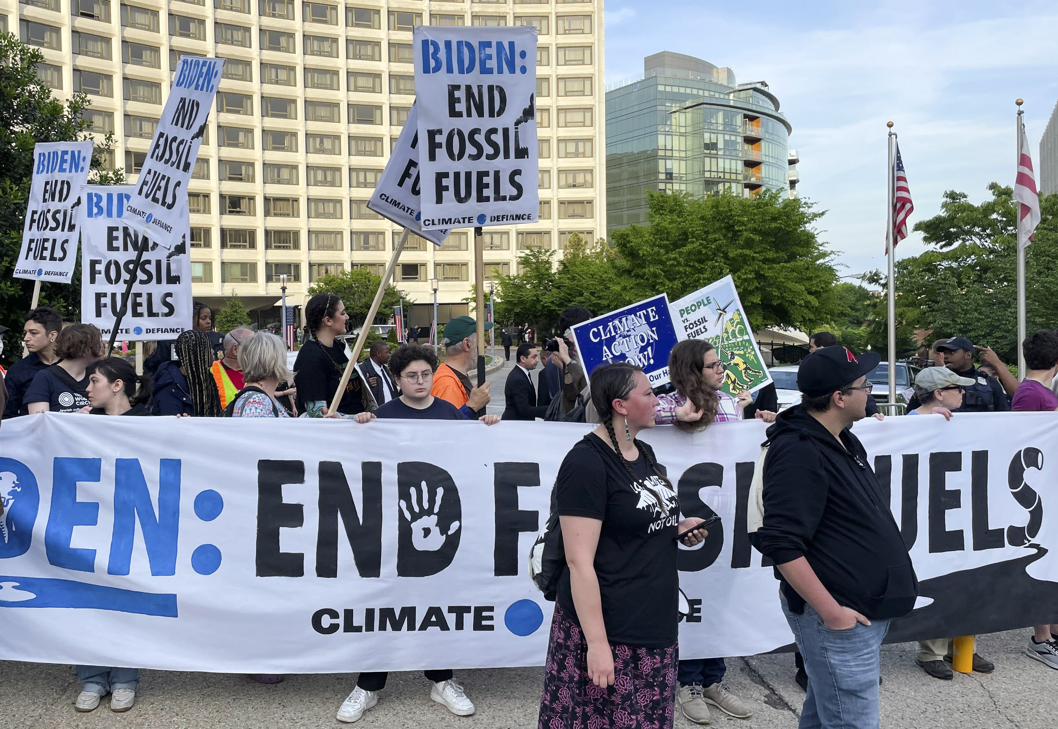 Climate activists protest outside the Washington Hilton.